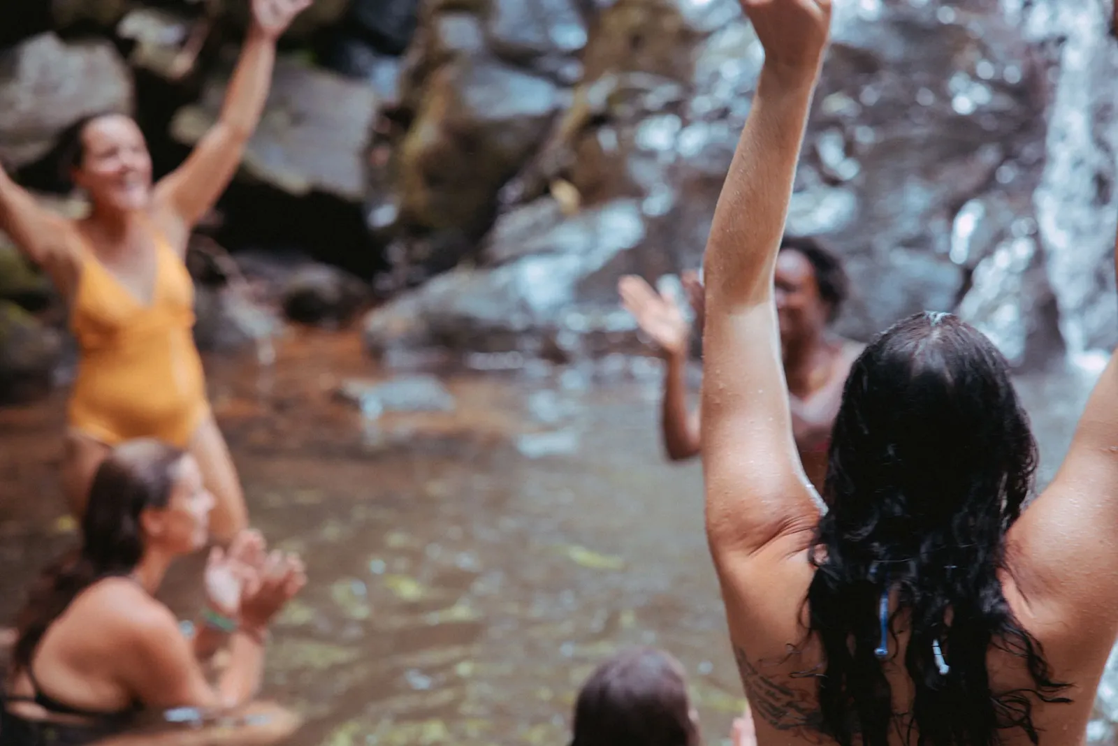 Students celebrating with arms raised at a Sedona retreat